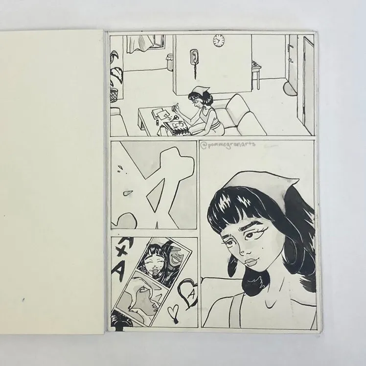 A panel of the graphic novel Aggie, showing Aggie looking at old photos of her with a girl in her home.