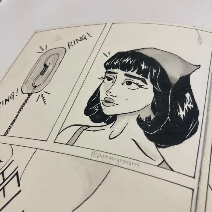 A panel of the graphic novel Aggie, showing Aggie getting a phone call on a landline phone in her home.